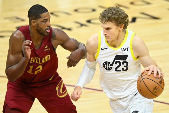 Dec 20, 2023; Cleveland, Ohio, USA; Cleveland Cavaliers center Tristan Thompson (12) defends Utah Jazz forward Lauri Markkanen (23) in the fourth quarter at Rocket Mortgage FieldHouse.
